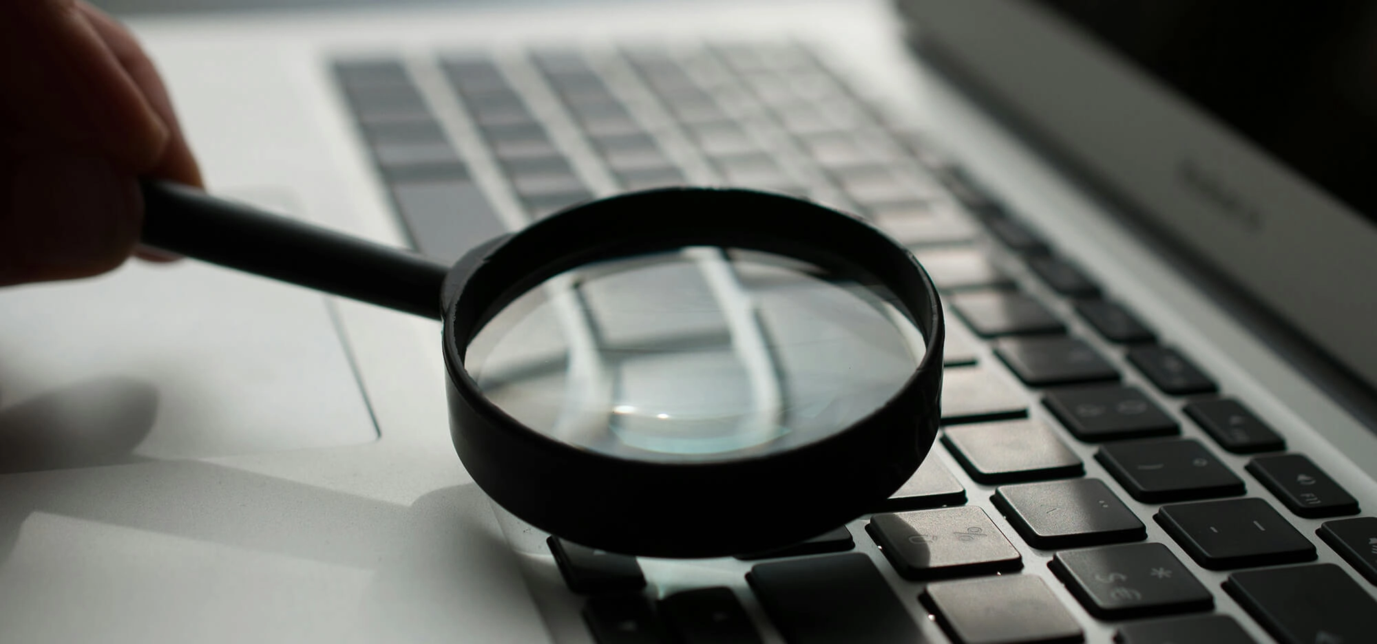 Magnifying glass on laptop